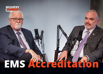 Two men sit in a studio setting with microphones, discussing "EMS Accreditation." The image features a professional atmosphere.