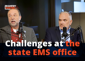 Two men sit at microphones discussing challenges at the state EMS office, with a focus on their conversation.